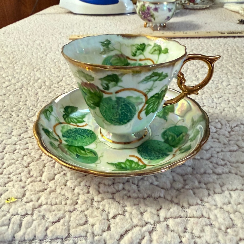 Elegant Green and Gold Tea Cup and Saucer Set